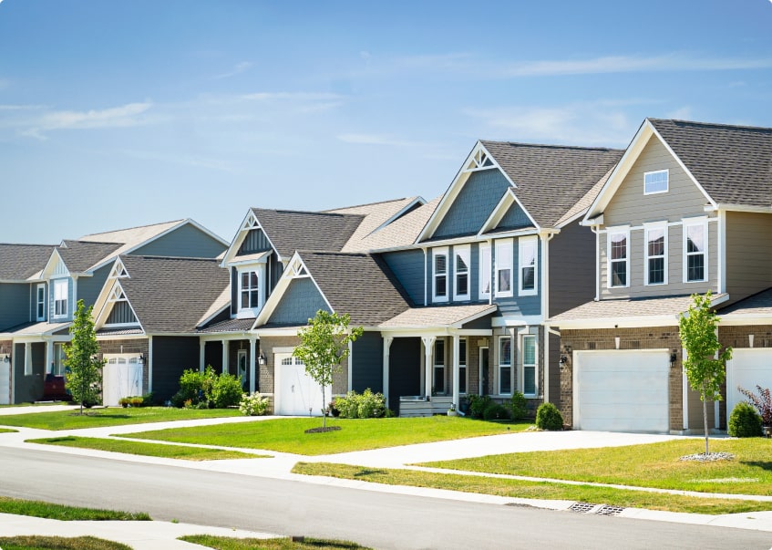 suburban neighborhood with 3 houses in view
